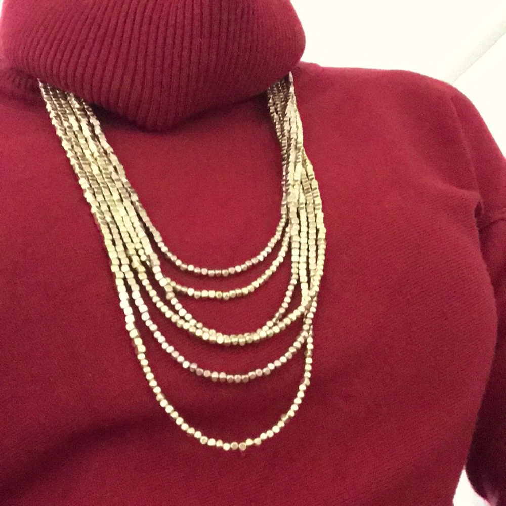 Six strand necklace of copper and gold beads